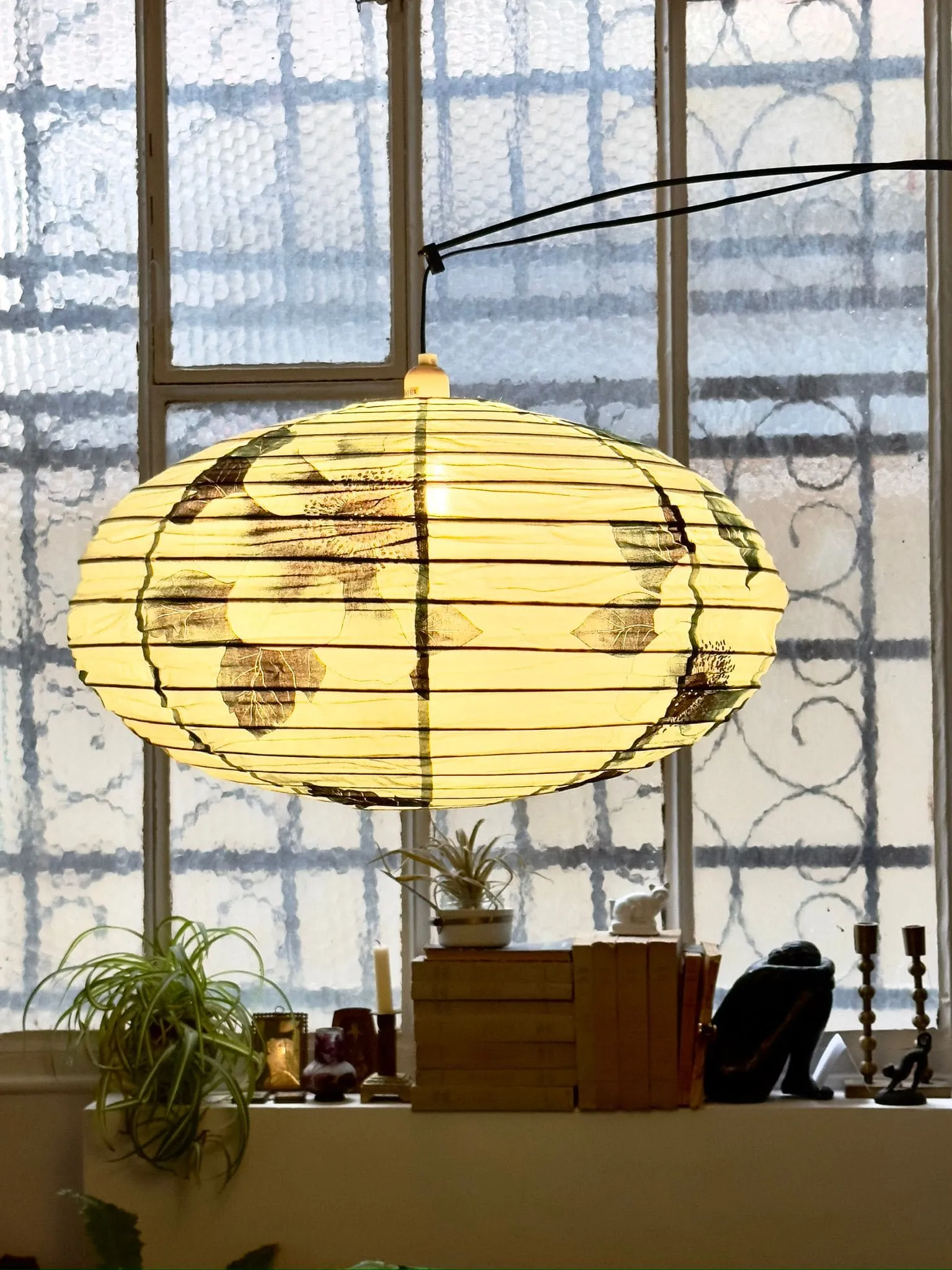 suspension sofa blue and green canvas and wallpaper in showroom decoration Paris Belleville