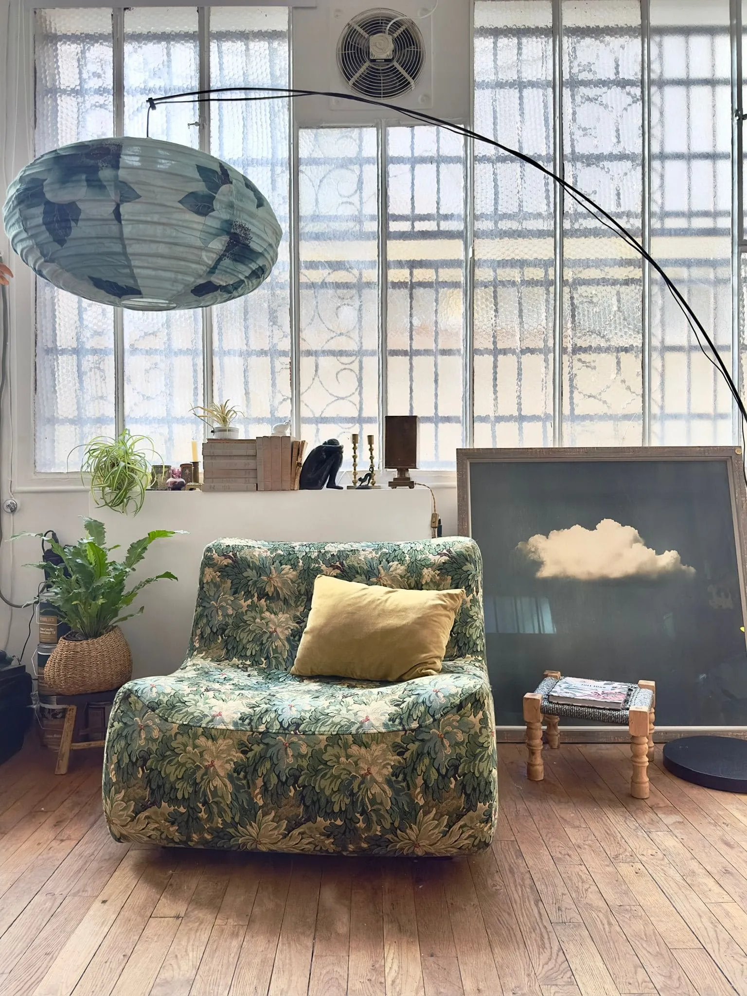 suspension sofa blue and green canvas and wallpaper in showroom decoration Paris Belleville