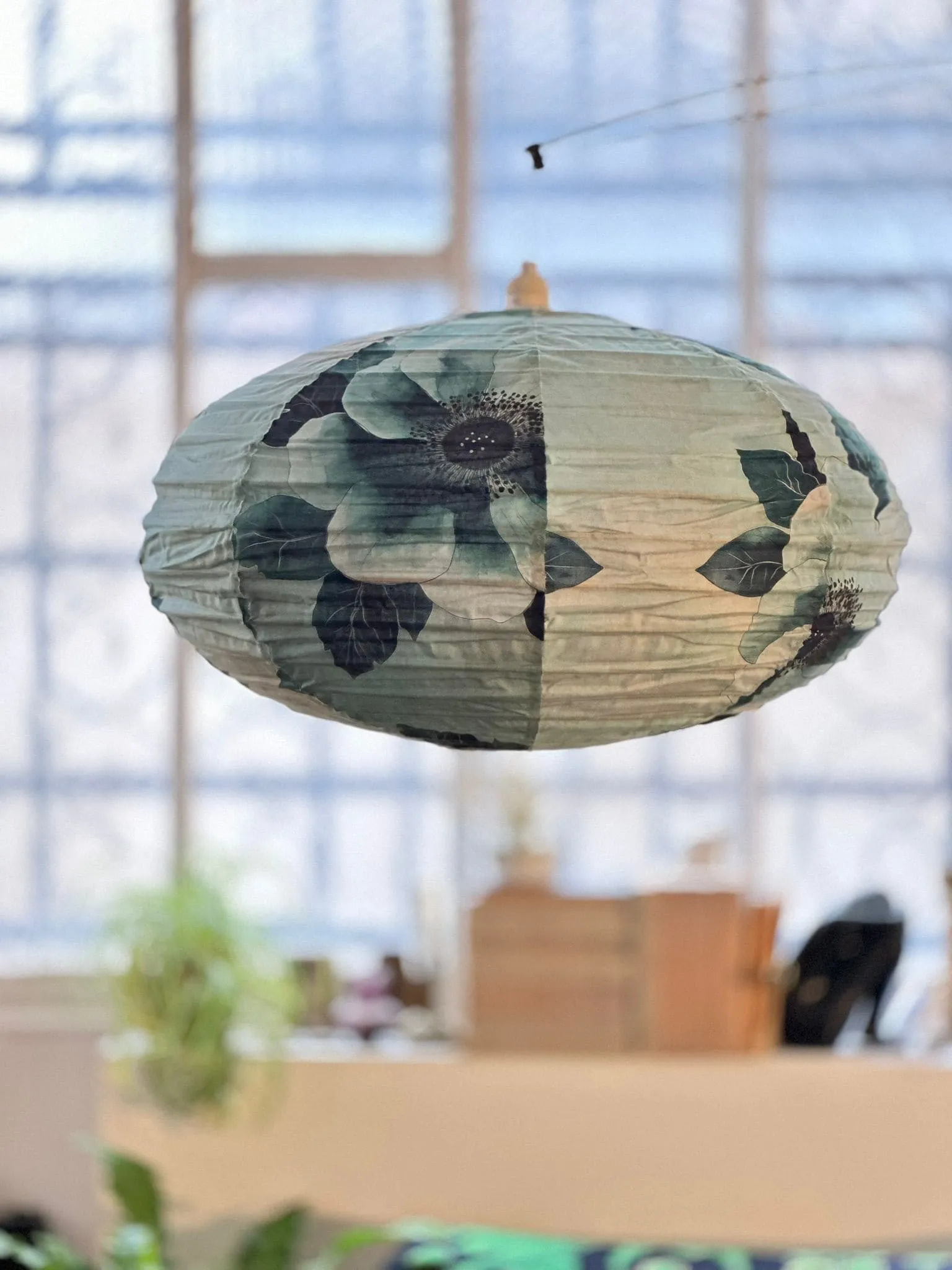 canvas and wallpaper hanging in showroom decoration Paris Belleville